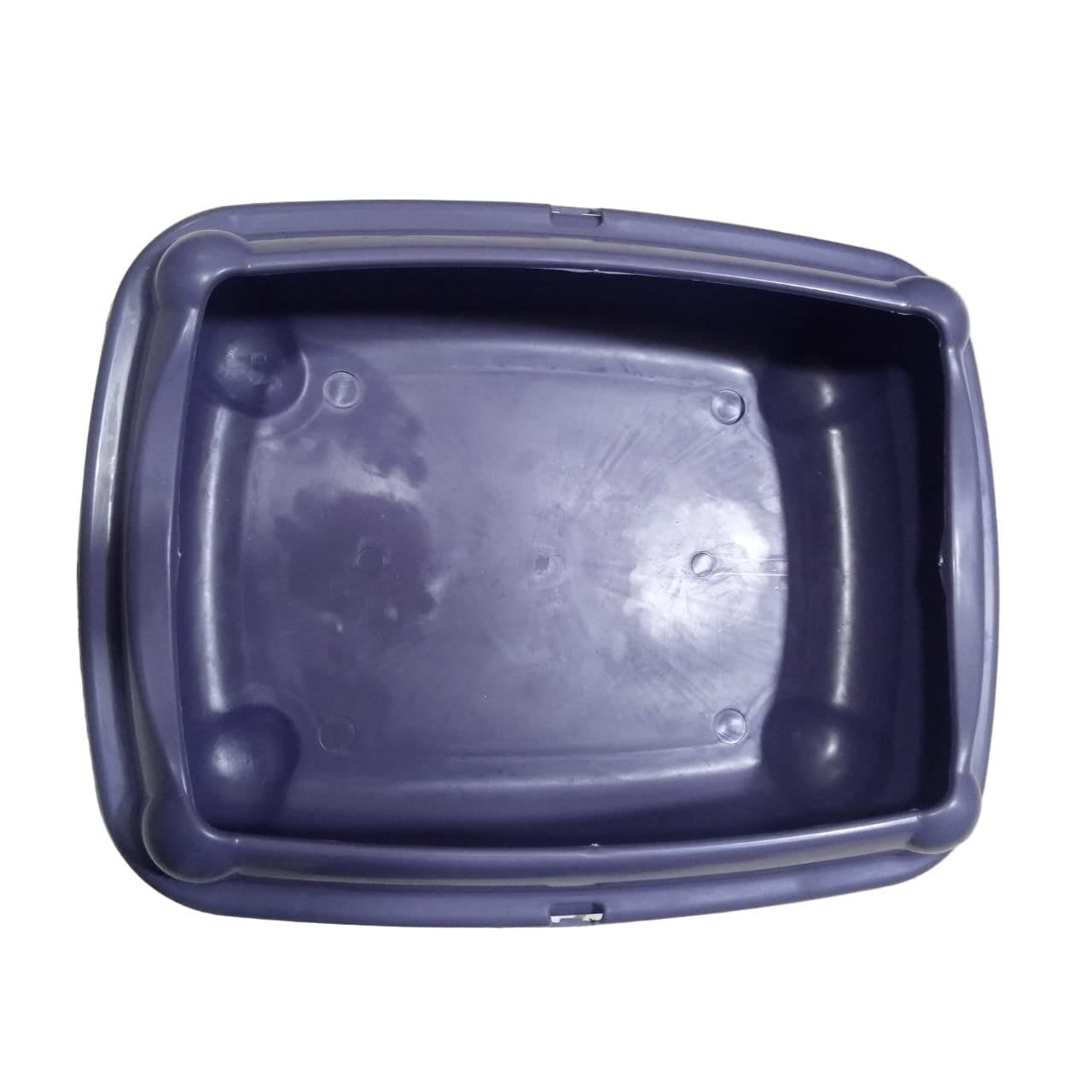 Purple plastic container on a tiled floor