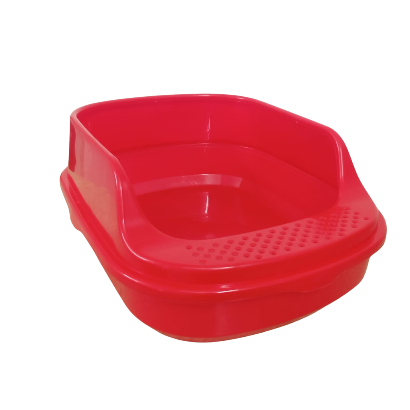 Red plastic pet toilet on a white background