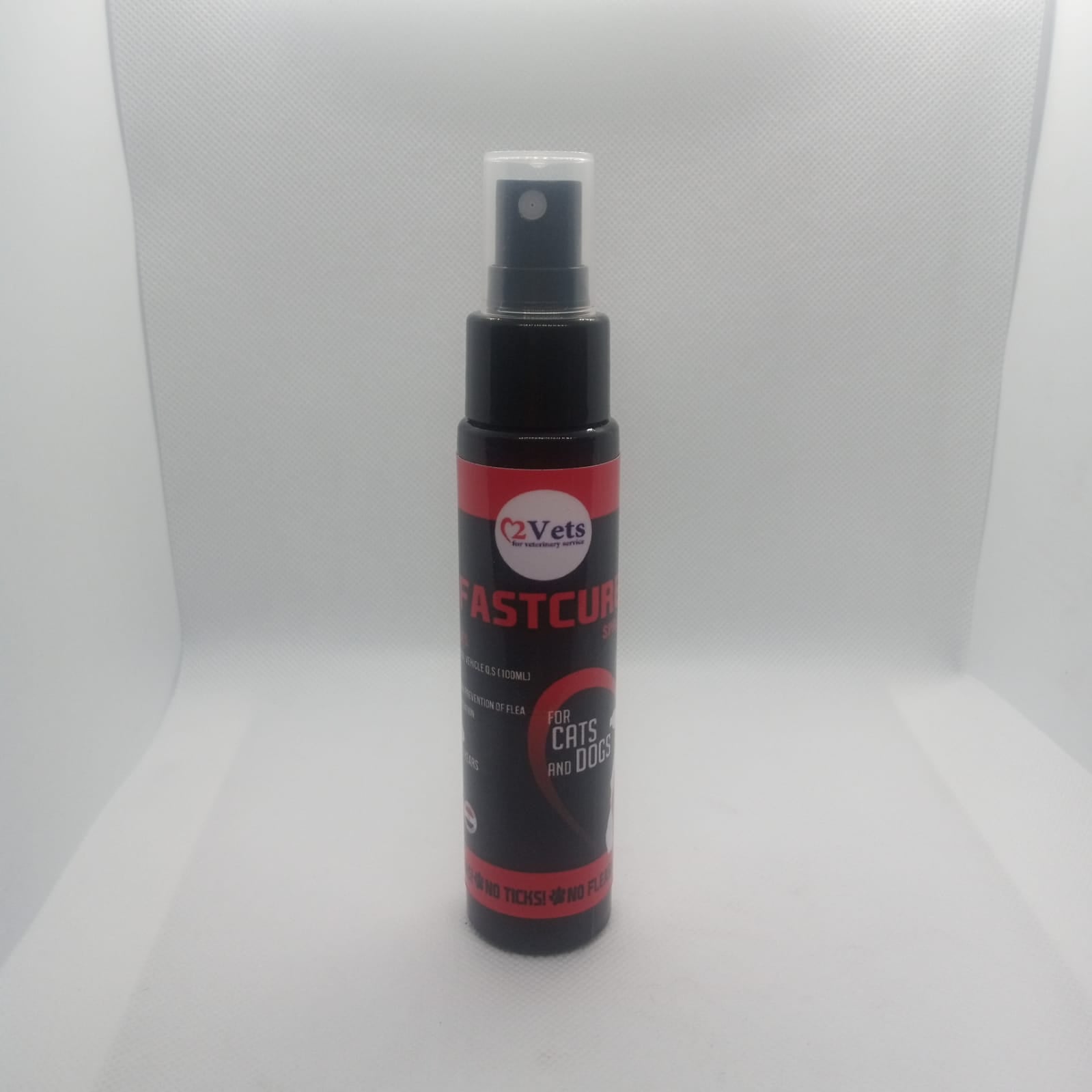 Black and red spray bottle with visible branding on a white background
