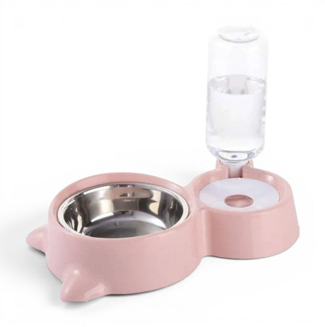 Pink pet bowl and water dispenser on a white background