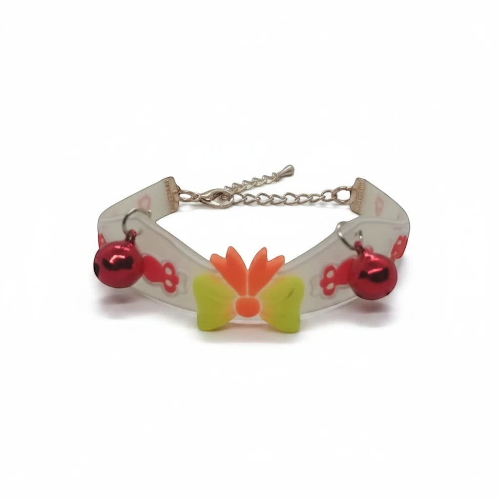 PetFriend fluorescent pet collar featuring a central bow, two red bells, and a gilded chain clasp.