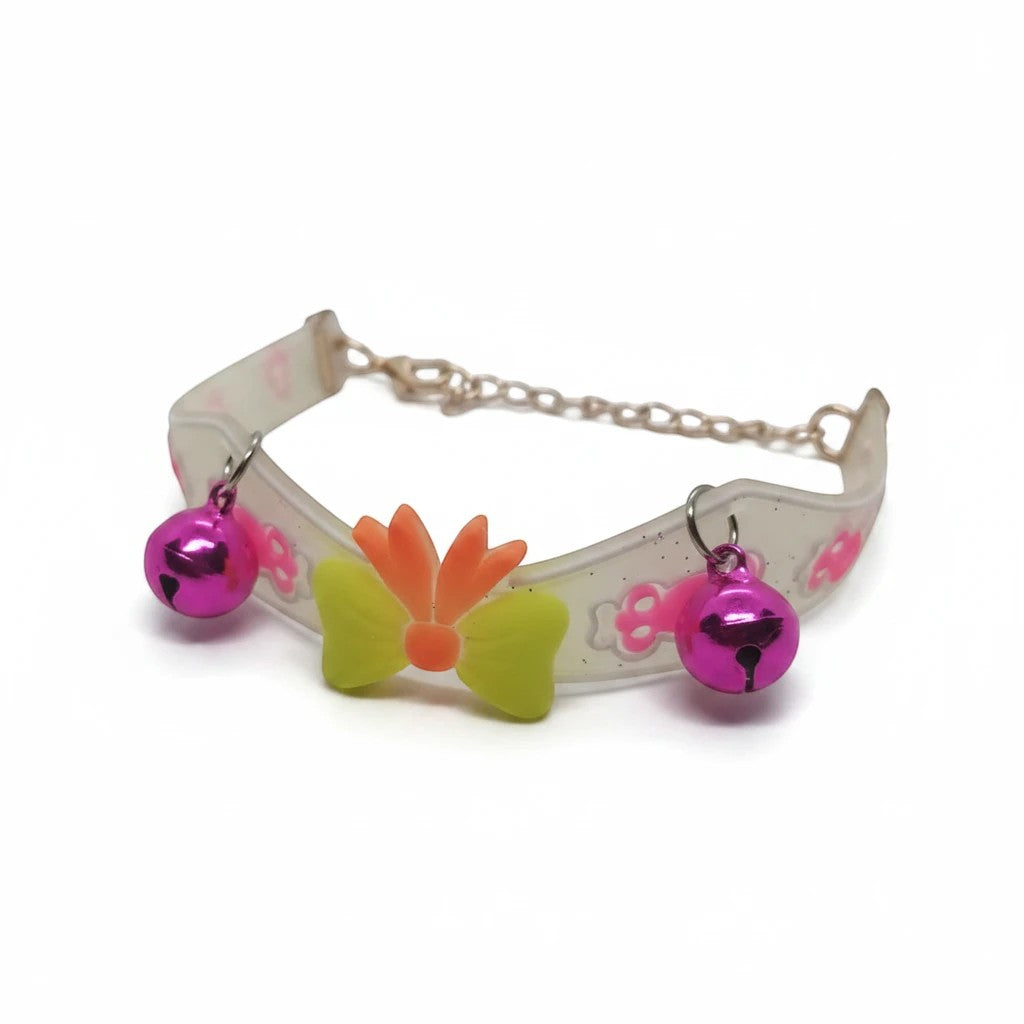 PetFriend fluorescent pet collar featuring a gilded chain, two pink bells, and a decorative yellow and orange bow.