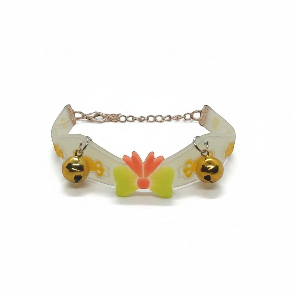 PetFriend fluorescent pet collar featuring a central bow, two gold bells, and a gilded chain link closure.